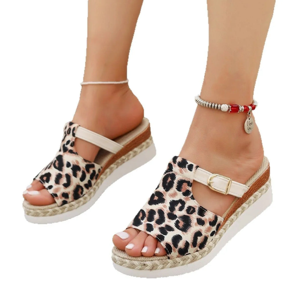 Leopard print women's platform wedge sandals in beige, shown from the side on a white background.