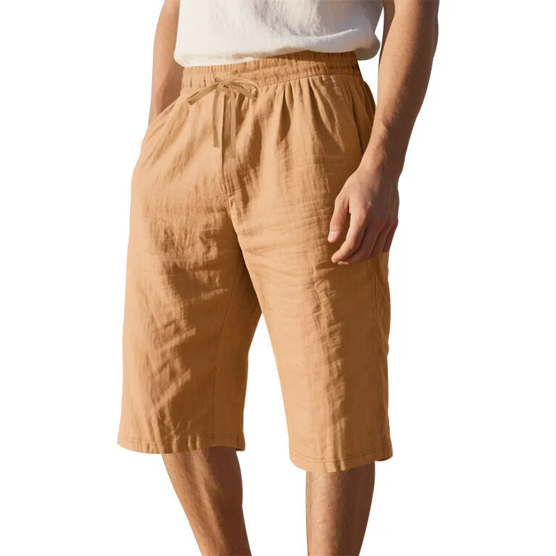 Men's solid colour linen shorts with a drawstring waistband in a light blue shade