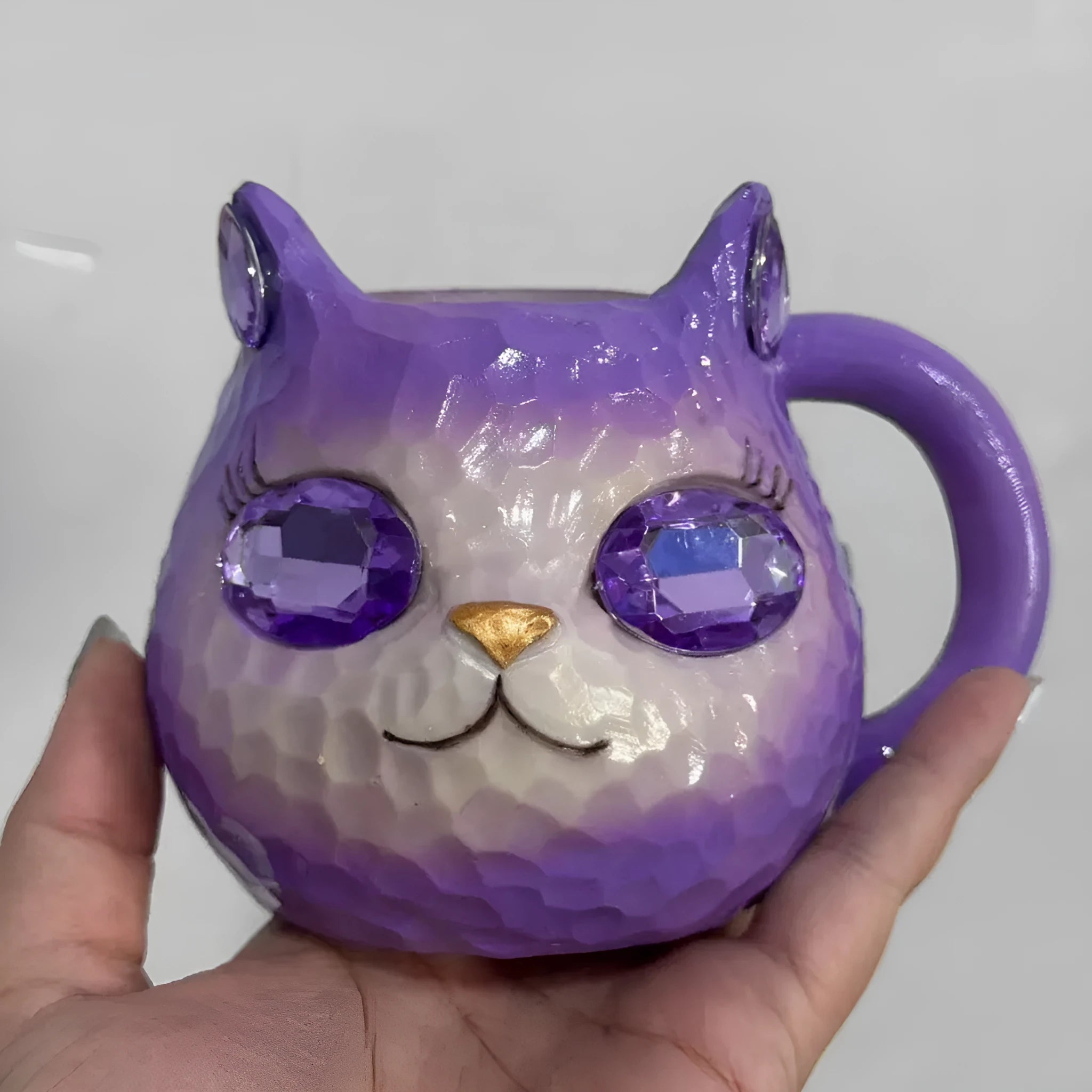 Resin Crystal Earth Cat Cup decorative ornament in purple, green, blue, and pink colour options.
