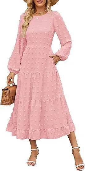 A beige high-waisted long sleeve dress with ruffled sleeves on a hanger.