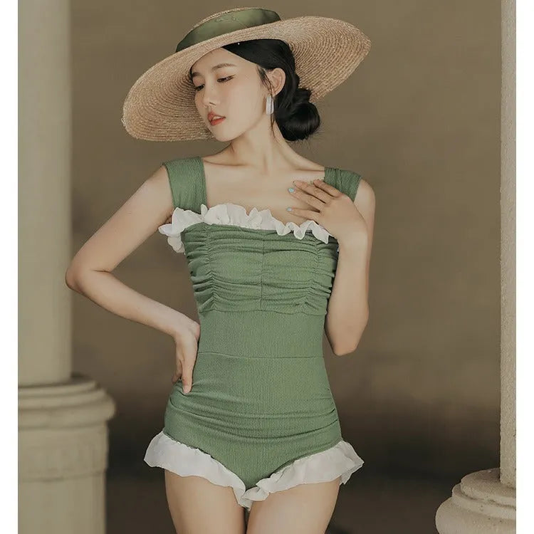 High-waisted one-piece swimsuit in quick-dry polyester fabric, shown in black.