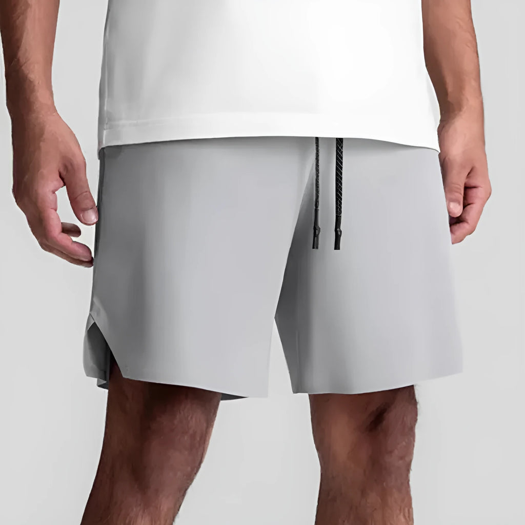 Men's grey seamless sports shorts with a straight leg and knee-length cut for summer athletics.