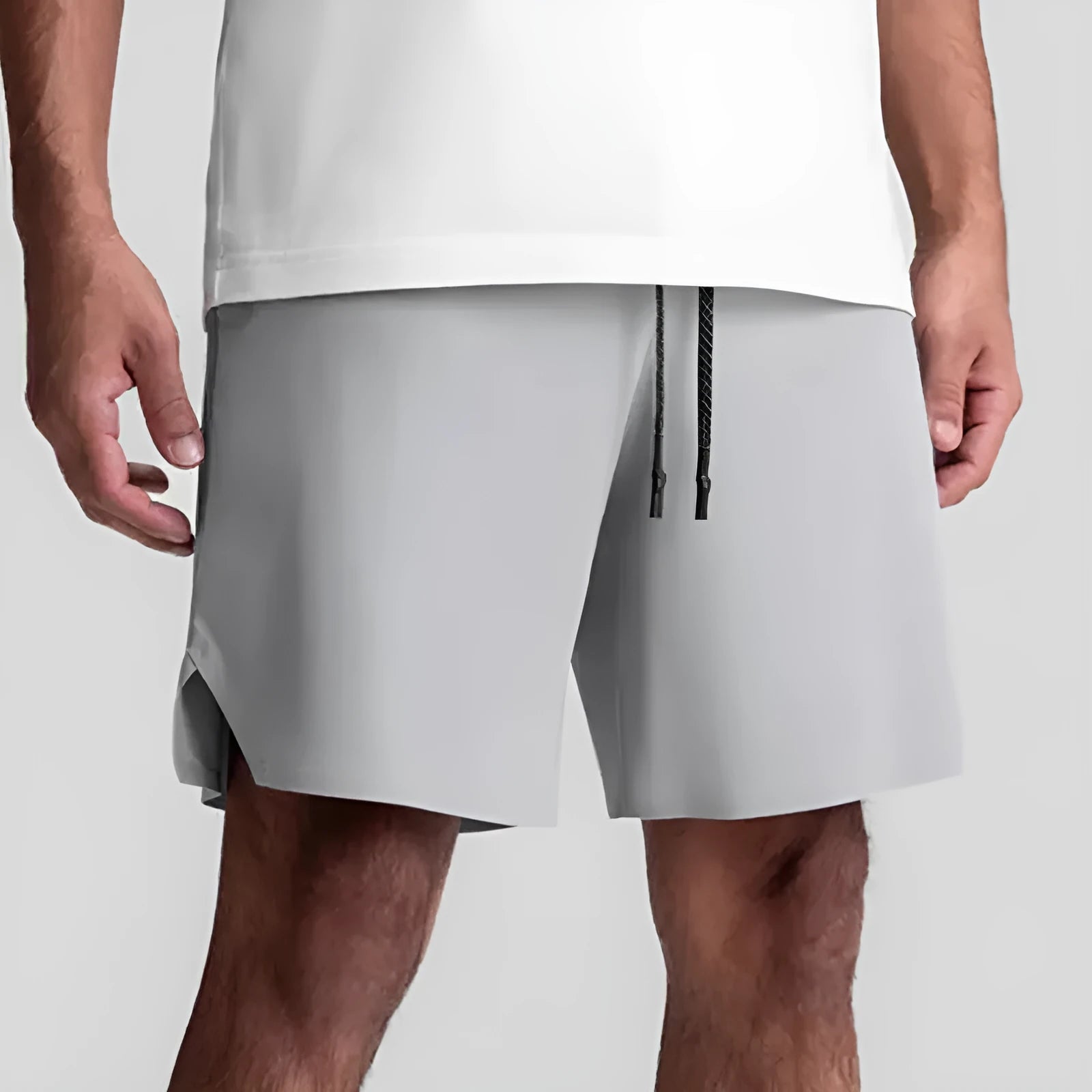 Men's grey seamless sports shorts with a straight leg and knee-length cut for summer athletics.