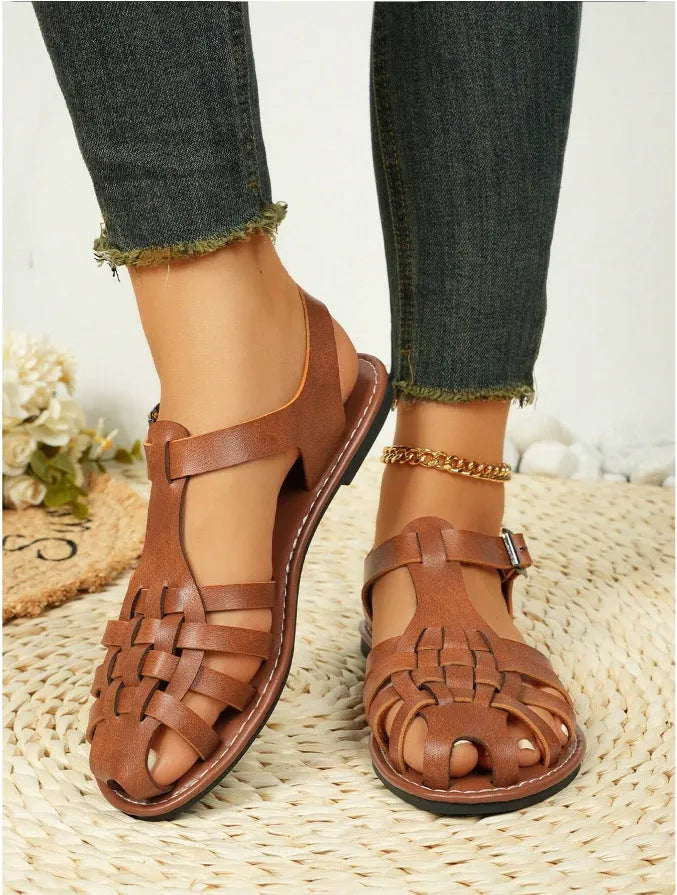 Dark brown women's vintage weave sandals with closed toe, roman buckle, and a soft rubber sole.