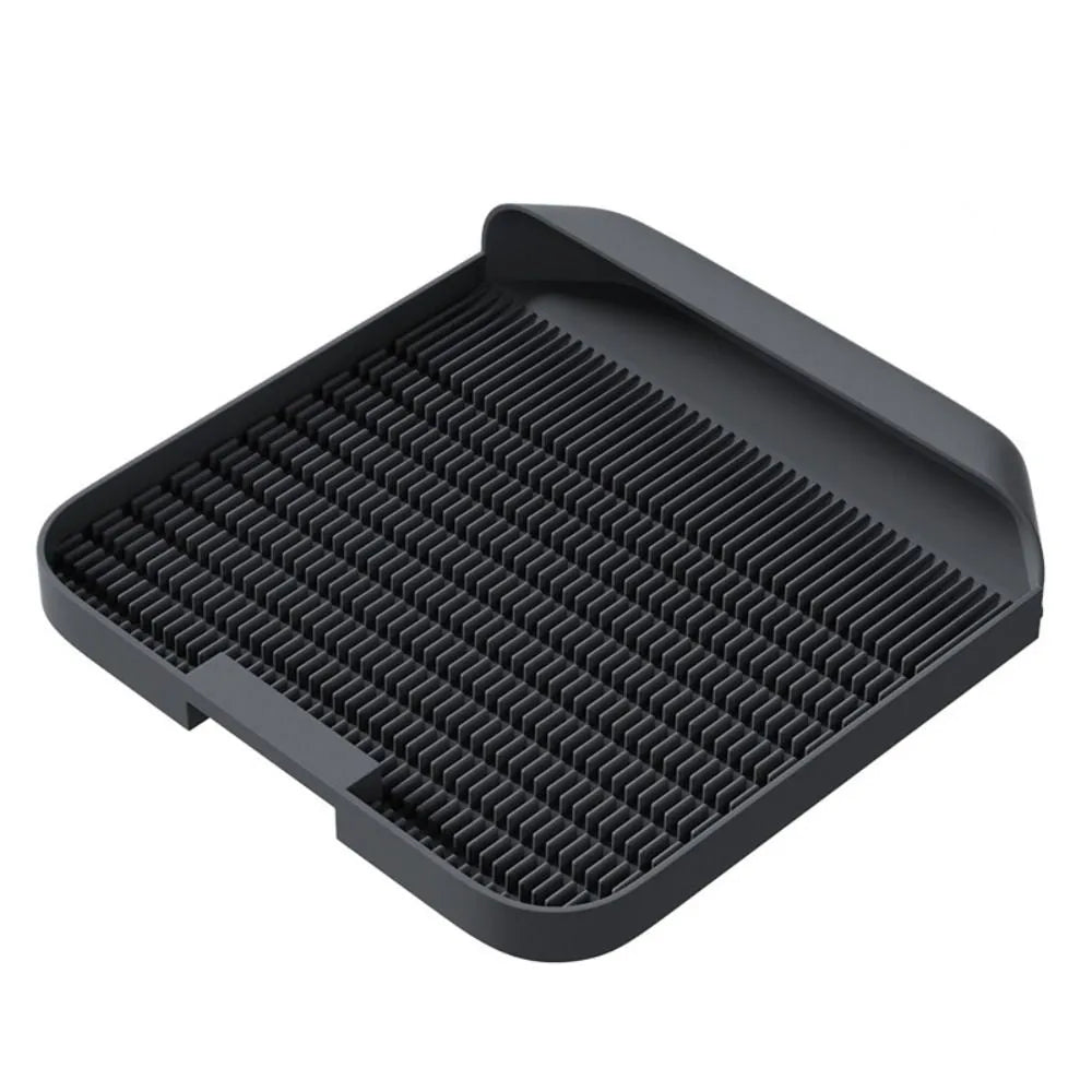 Large square black cat litter pedal mat with slanted design and textured grooves