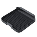 Large square black cat litter pedal mat with slanted design and textured grooves