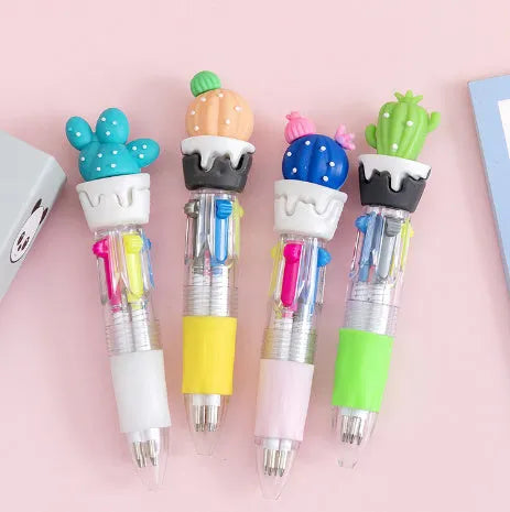 Cartoon-themed four colour press ballpoint pen with plastic and silicone body on a white background.