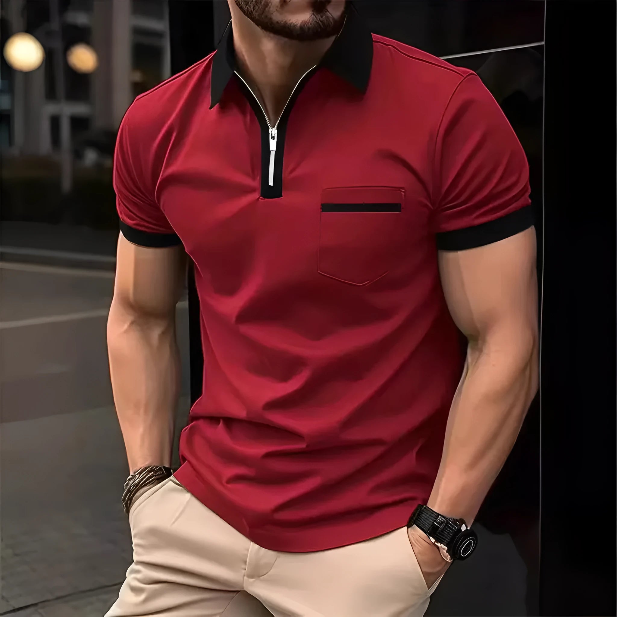 Man wearing a loose-fit men's short sleeve casual shirt with a chest pocket and zipper decoration.