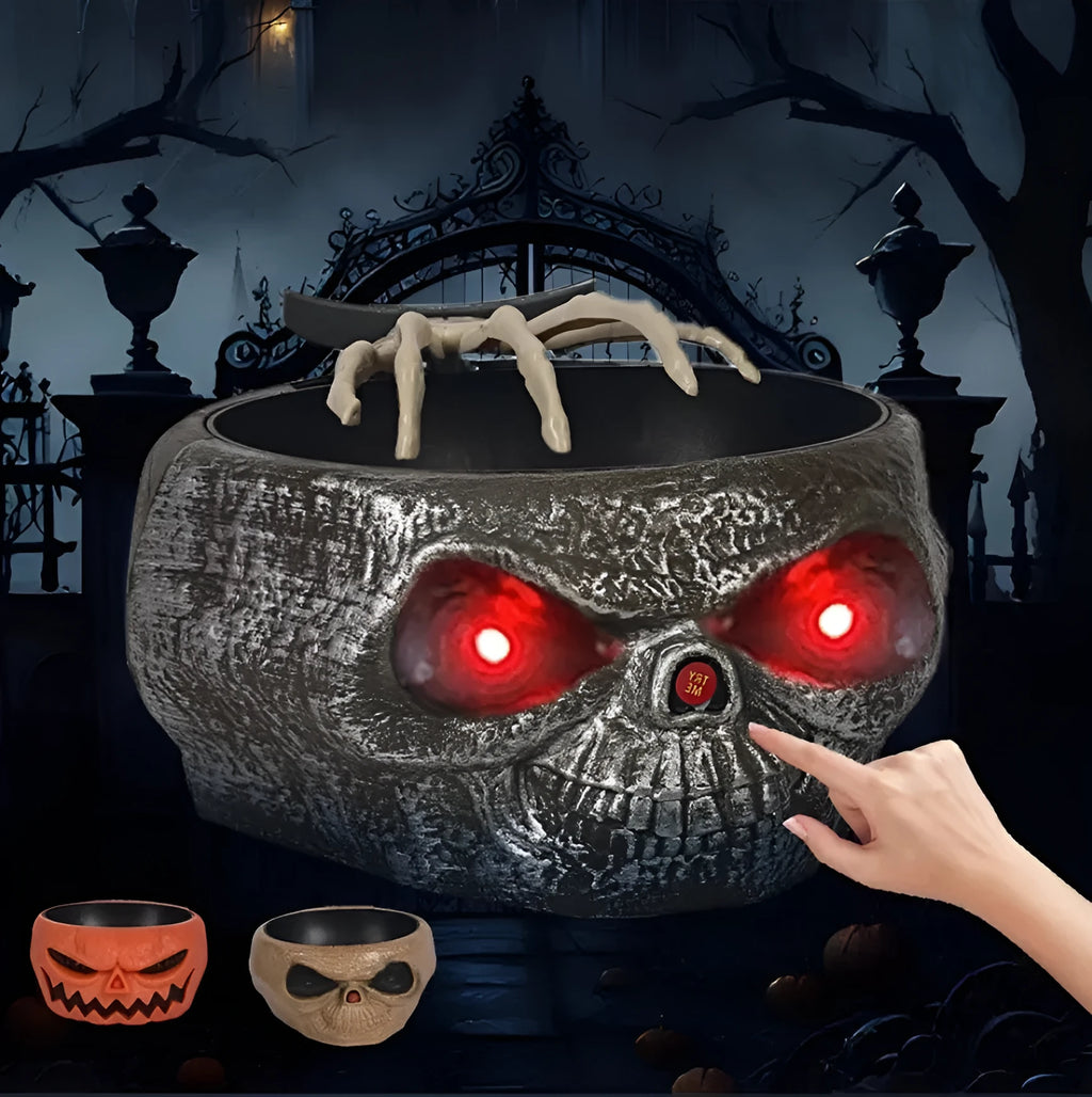 Motion activated Halloween candy bowl plastic pumpkin shape with skeleton hand and glowing red eyes