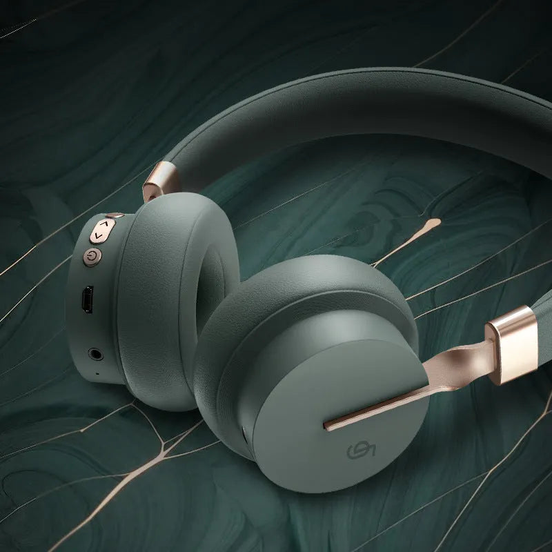A solid colour Bluetooth headset shown in one of five colours: black, blue, green, red, or white.