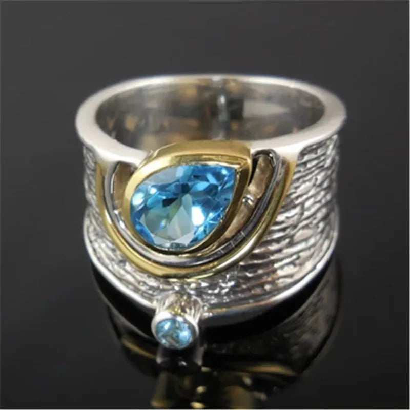 Chinese-style women's ring with blue rhinestones in drop shape design on alloy band