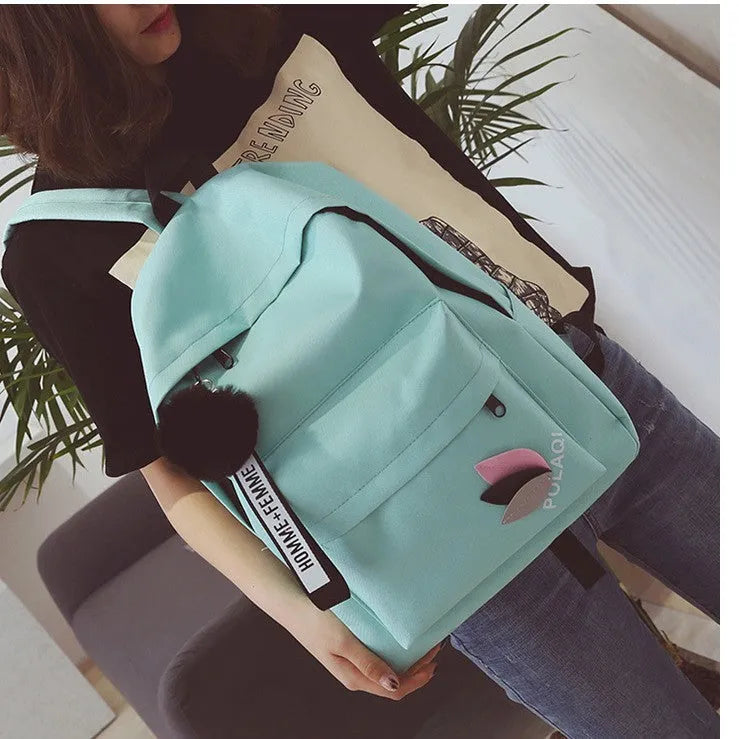 Green canvas college style schoolbag with leaves pattern and anti-theft features