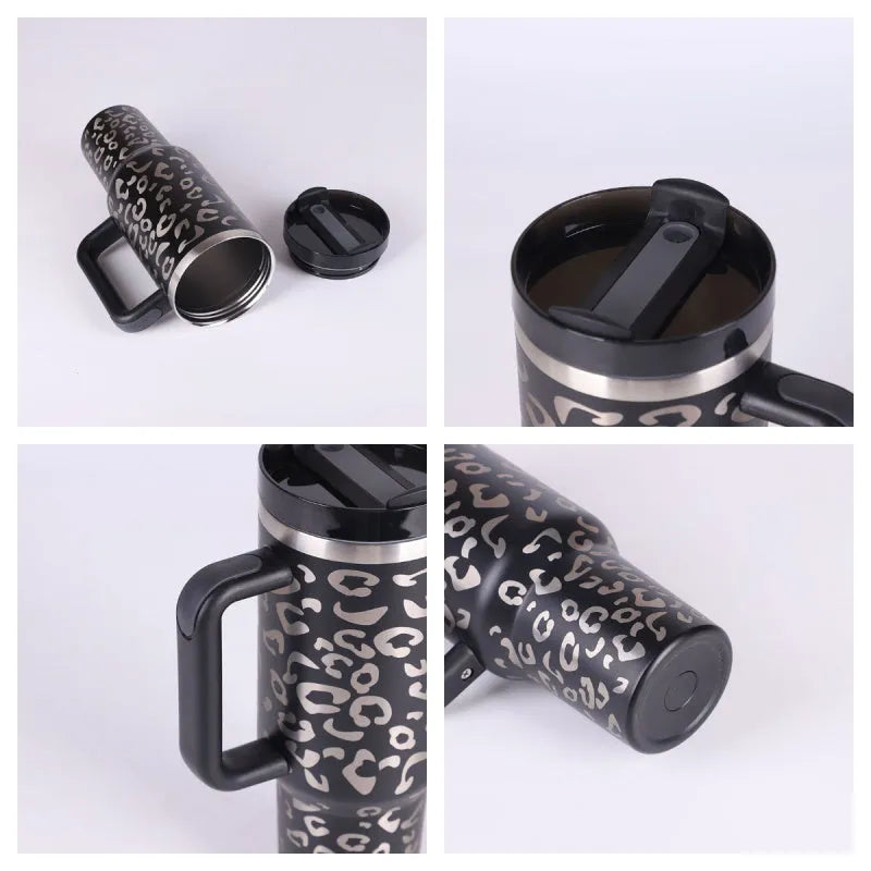 40 oz stainless steel insulated tumbler with a black handle, straw, and grey lid on a wooden table