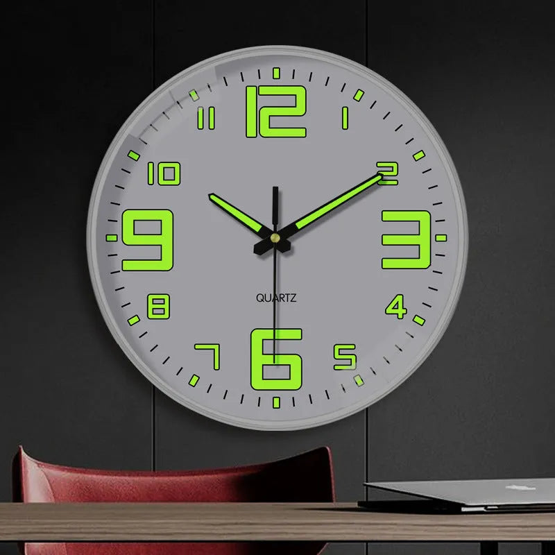 Modern 8 inch luminous wall clock in plastic case on a wall.