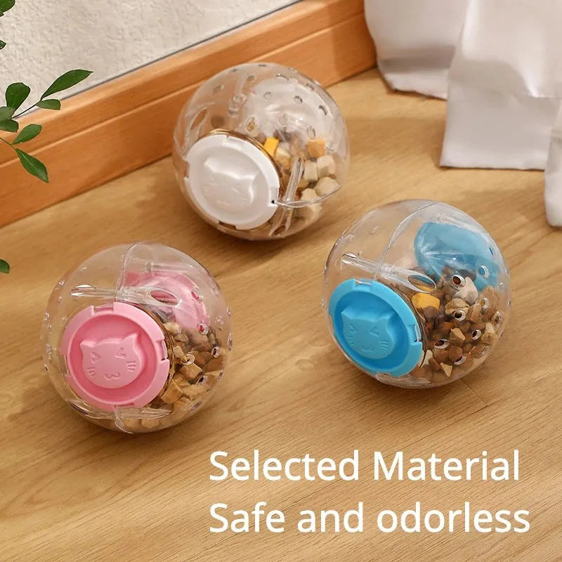 Blue slow feeding ball for cats with leak holes for gradual food dispensing