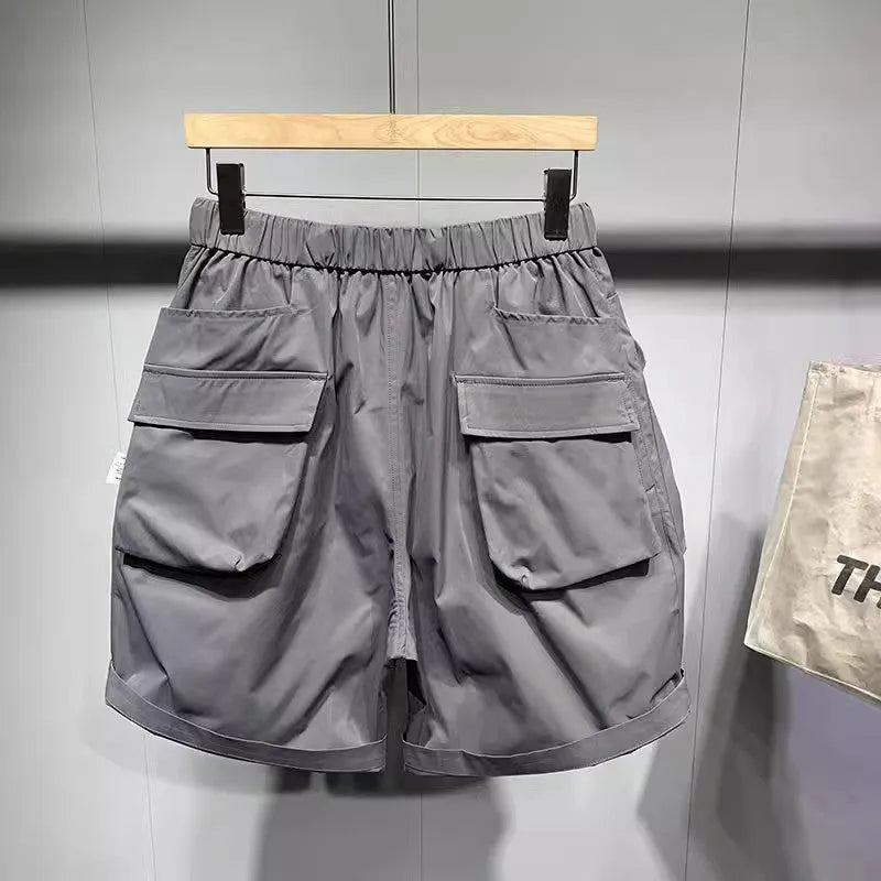 Men's loose-fitting casual shorts with multiple pockets in black or grey colours