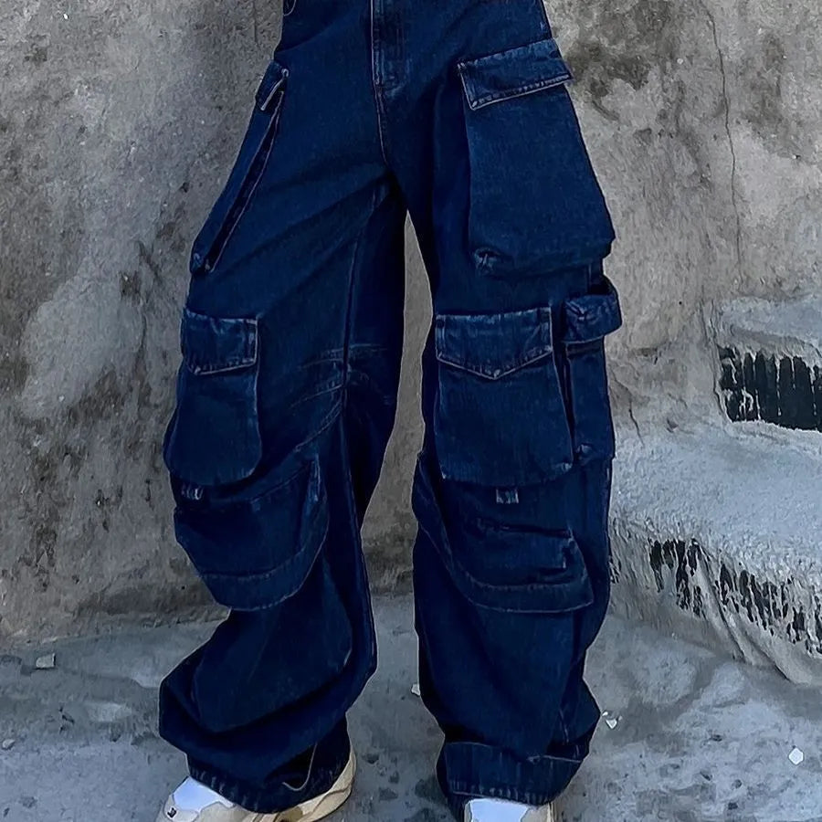 Dark blue distressed wide-leg jeans with a high waist and multiple pockets on a hanger