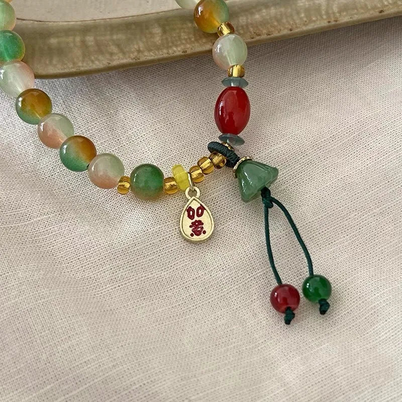 Handcrafted lotus ruyi bracelet with mixed materials and traditional Chinese design