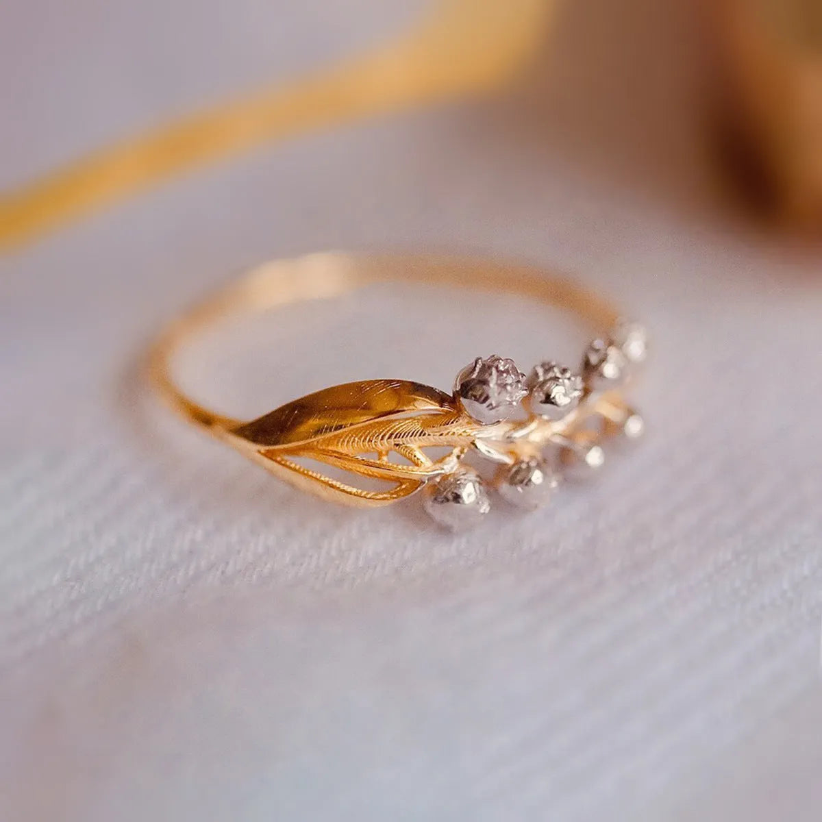 S925 pure silver bell orchid ring with micro inlay, champagne gold finish, on white background