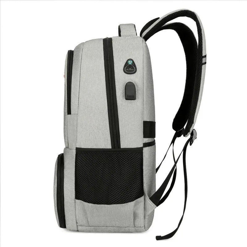 Light grey insulated Oxford cloth backpack with curved shoulder straps, shown with its pull rod belt accessory.