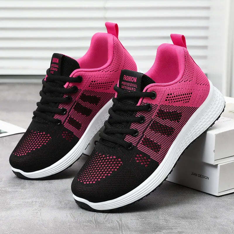 Women's Flyknit running shoes in black, rose red, and grey pink on a white background
