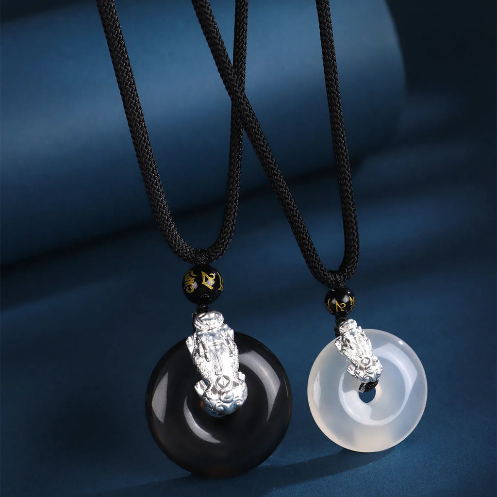 Silver necklace with peace buckle agate pendant showing safety clasp detail