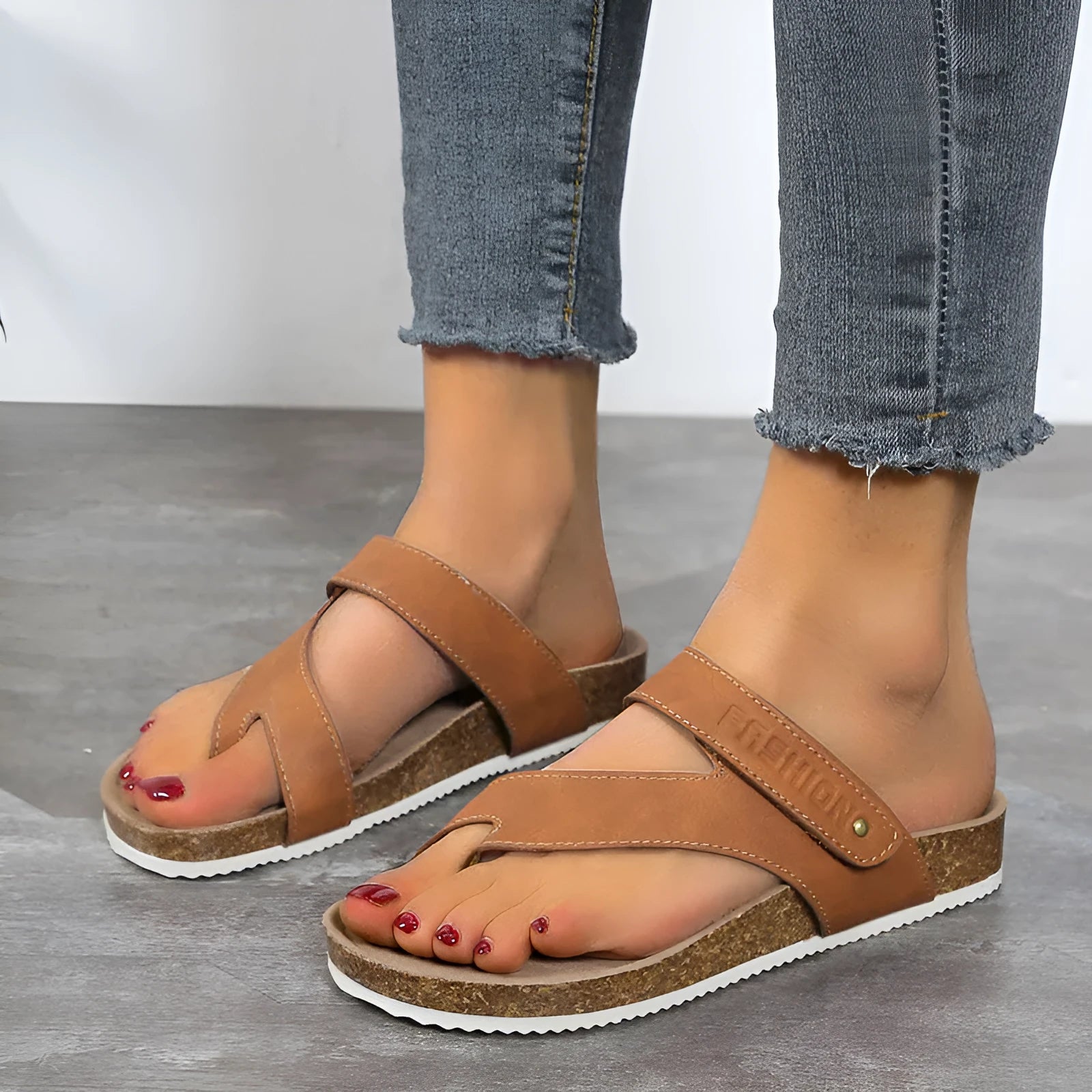 Flat toe ring flip-flops with a thick foam sole in a solid blue colour on a white background.