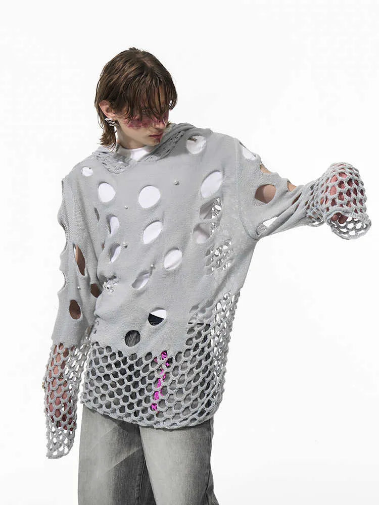 Black men's loose hoodie with a pearl decoration on the hood, shown on a model.