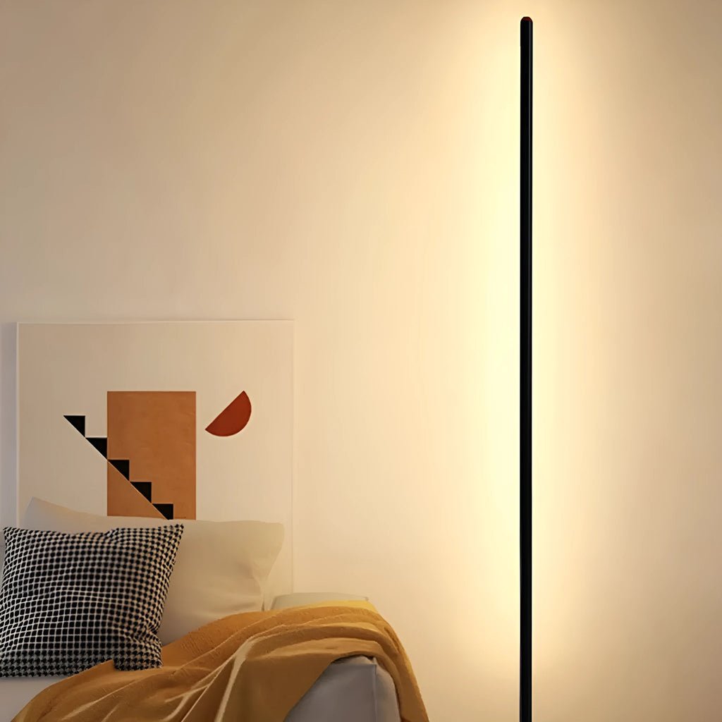 Vertical aluminium alloy floor lamp in modern simple style placed beside a sofa.