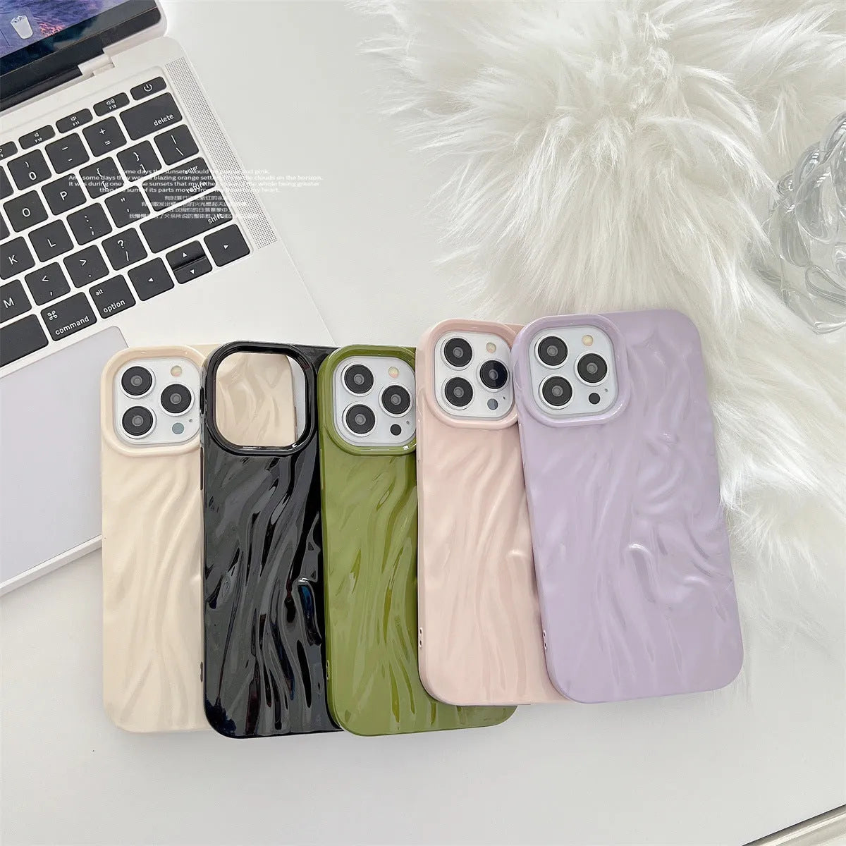 Solid colour water ripple texture silicone phone case for iPhone, shown in milky white, pink, and purple colour options.
