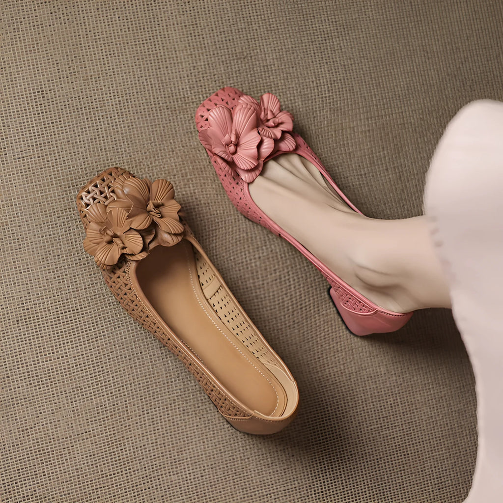 Women's light brown cowhide leather open weave pumps with a mid heel on a neutral background.