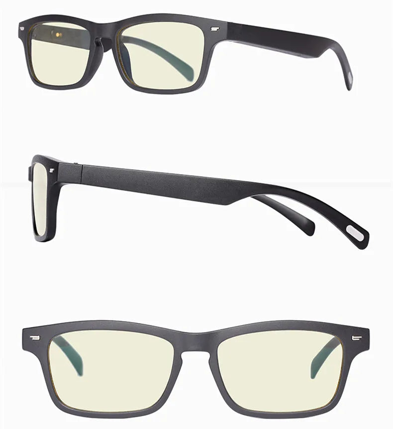 Black smart glasses with Bluetooth speakers and tinted UV-protection lenses on a table.