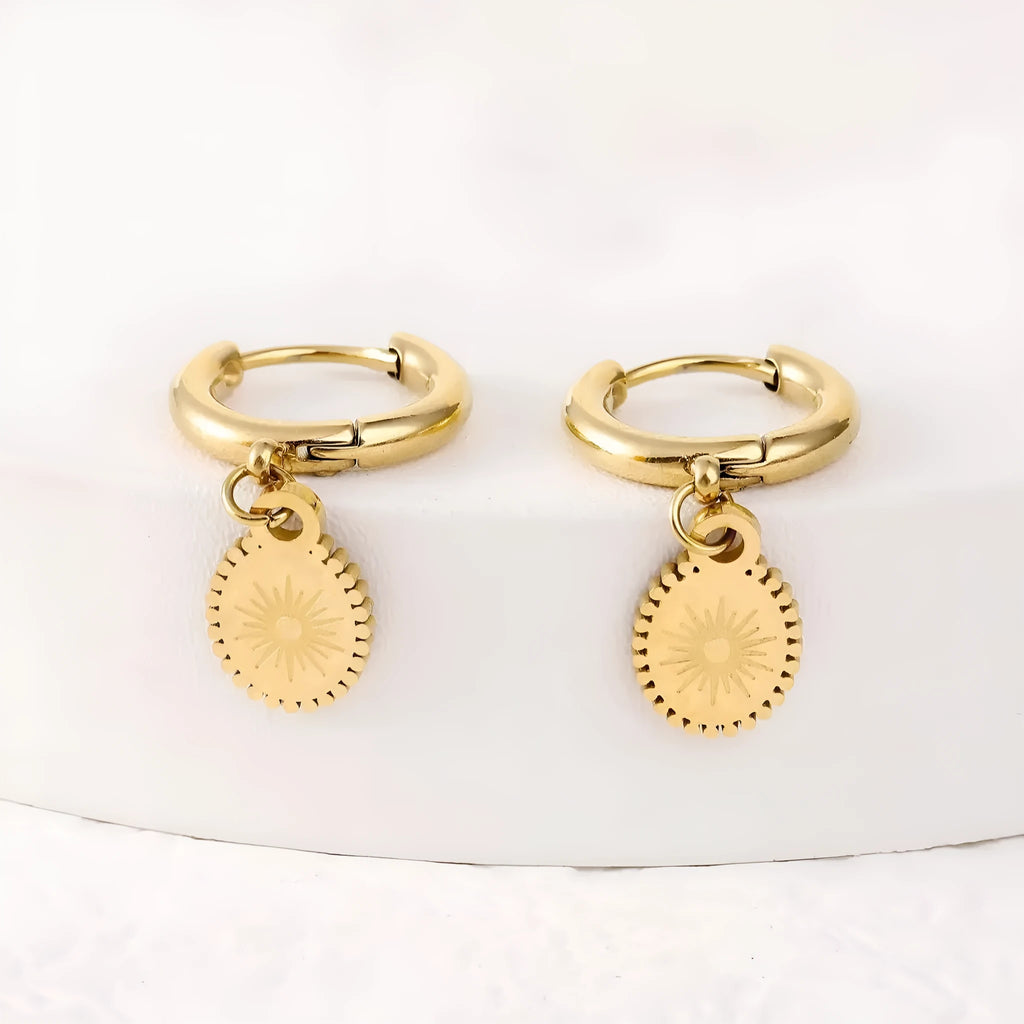A pair of stainless steel geometric ellipse earrings with an ear button fastening, colour XY-EH005.