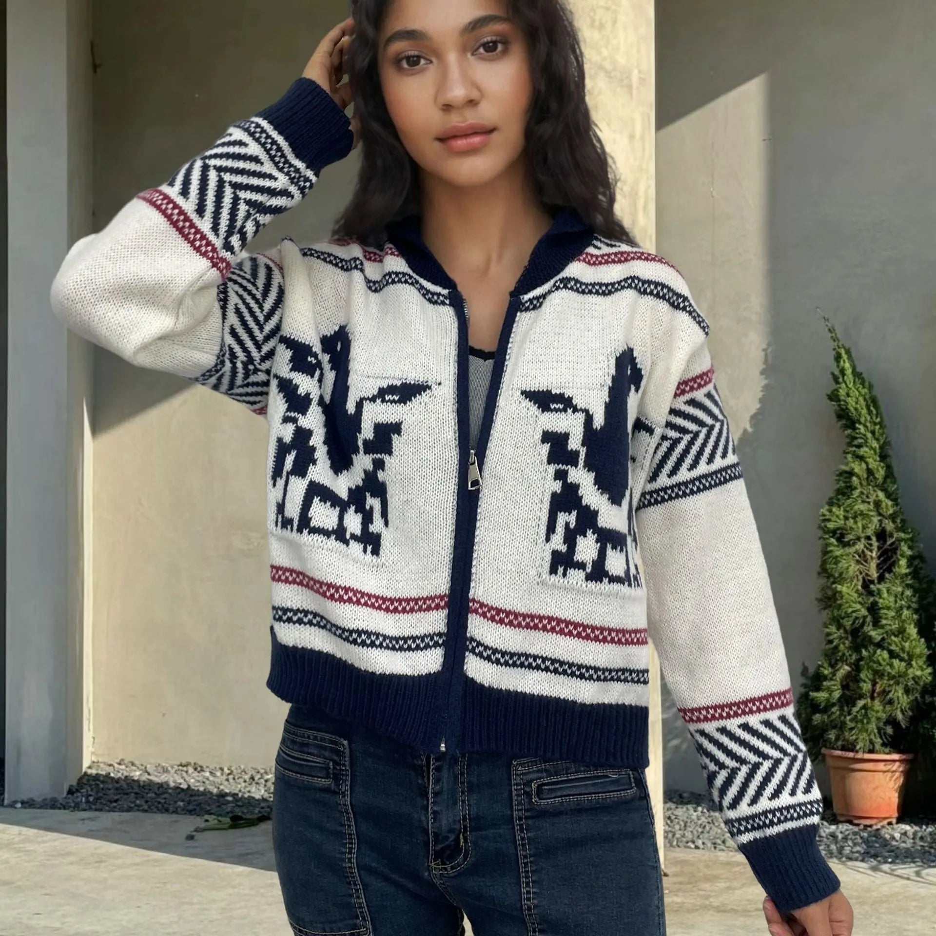 White women's zip-front cardigan with a lapel collar and jacquard knit pattern.