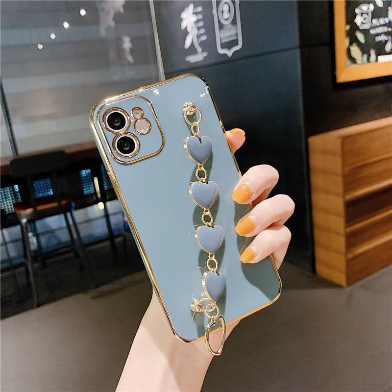 Green silicone phone case with a bracelet loop attached, compatible with Samsung and iPhone models.