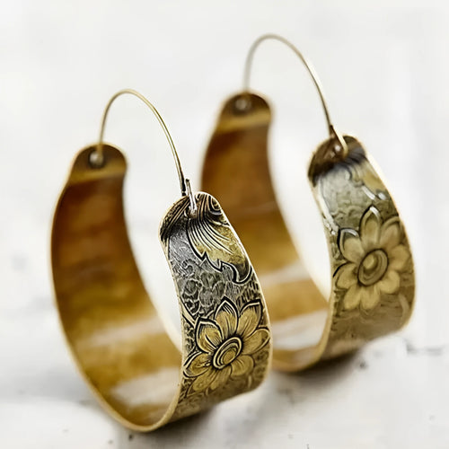 Gold electroplated women's earrings with hollow geometric petal pattern design