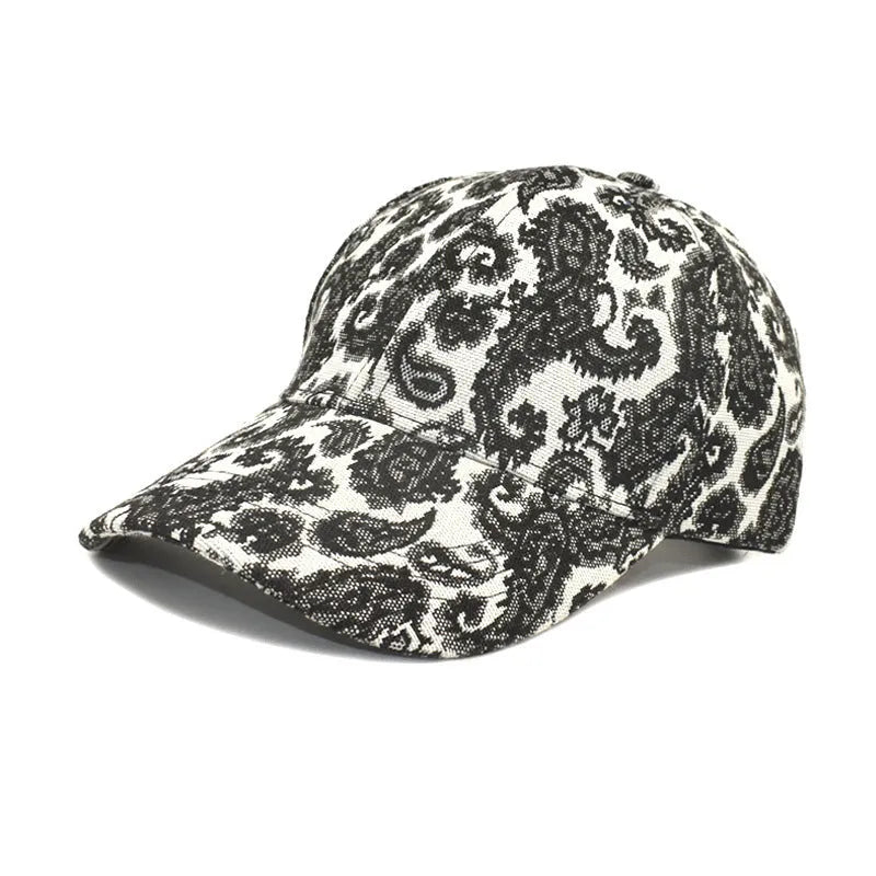 Blue paisley print polyester baseball cap with a dome crown, shown from the side.