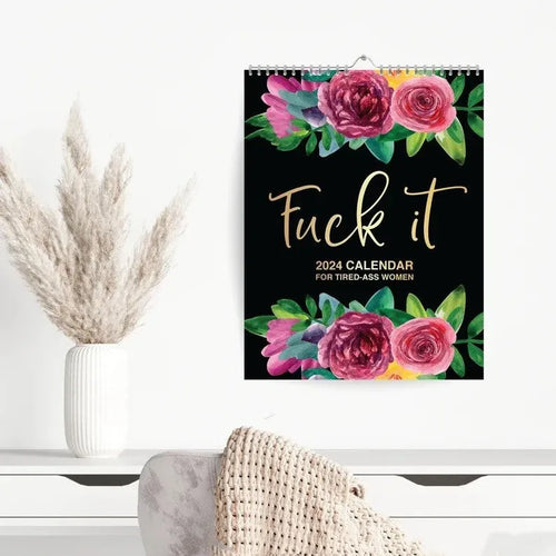 2024 wall calendar for tired women with coil binding showing monthly spread and funny sweary sayings