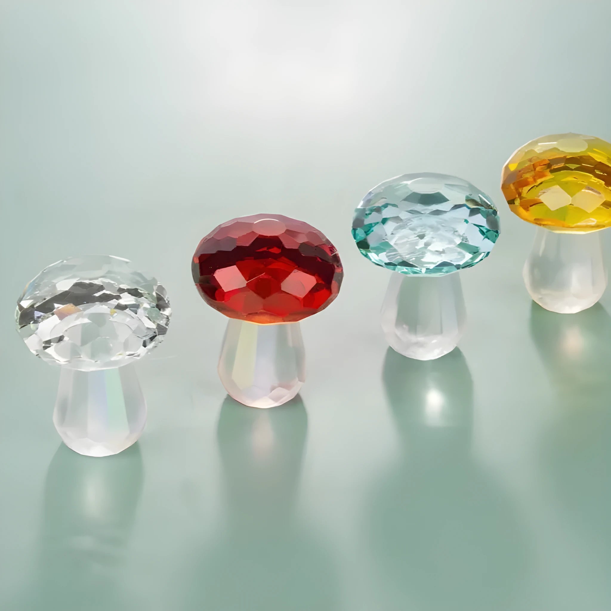 Colourful mushroom-shaped crystal decoration in geometric style on a surface, showing light green hue.