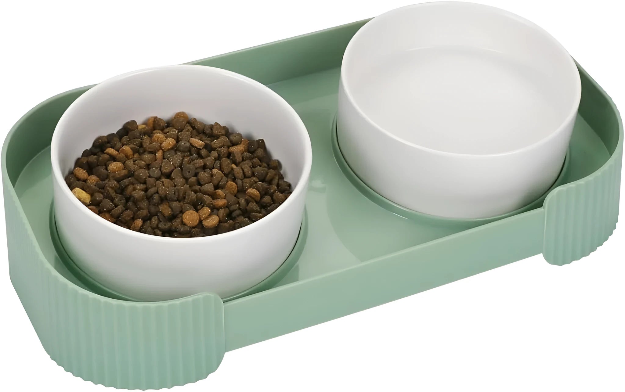 Green ceramic elevated cat feeder with two tilted bowls on a non-slip stand