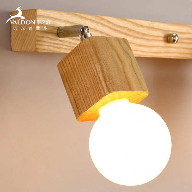 Single head 24cm LED wall lamp mounted beside a mirror.