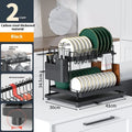 White double-layer kitchen storage rack with removable draining feature on a countertop.