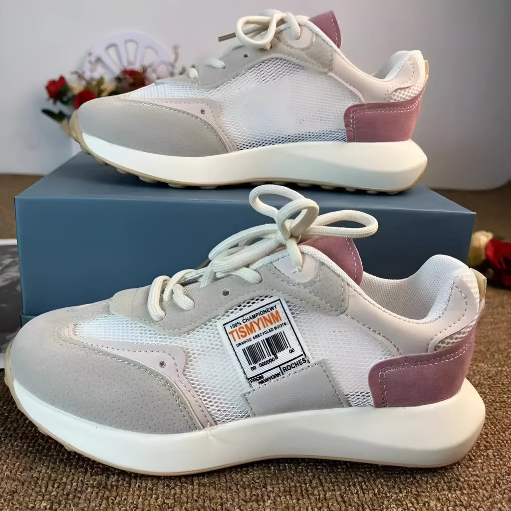 Women's grey and pink retro sneakers with low-top design and rubber soles