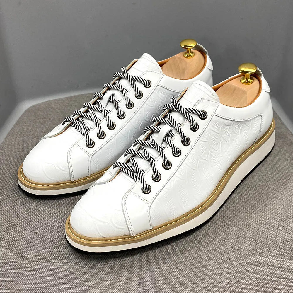Men's white low-top casual shoes with embossed pattern texture on the front, featuring front tie laces.