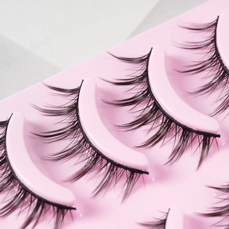 Bundle of manga false eyelashes showing three wispy styles 007, 008, and 009 on a black plastic terrier strip.