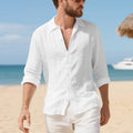 Man wearing a light blue loose-fit linen casual shirt with a button front and classic collar.
