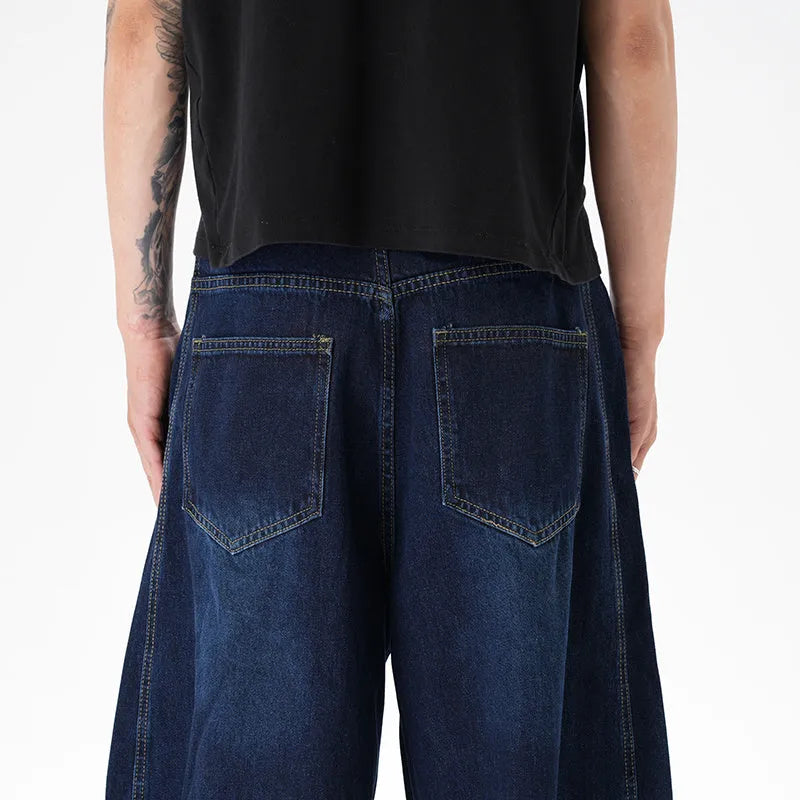 Women's washed distressed dark blue wide leg machete jeans on hanger