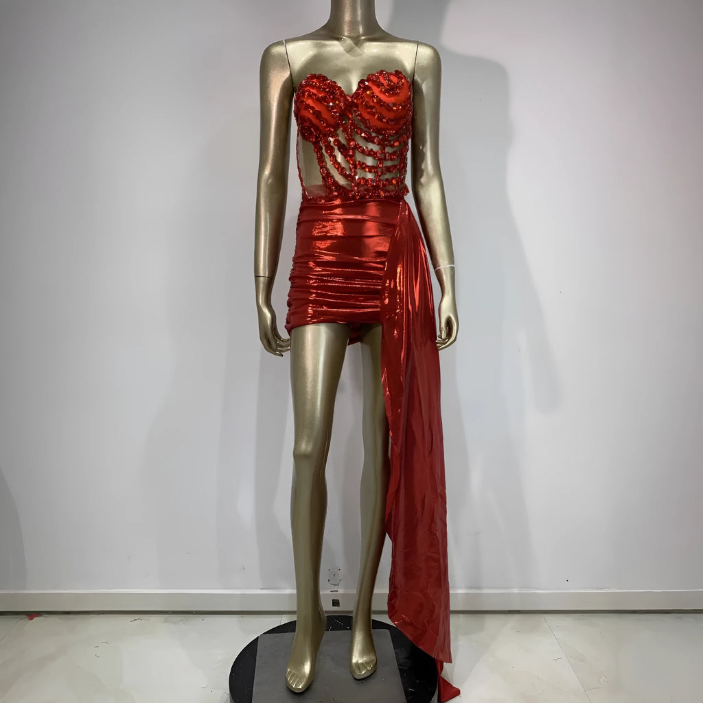 Red two-piece stage costume with hollow mesh panels and a skirt, made from stretch spandex for performers.