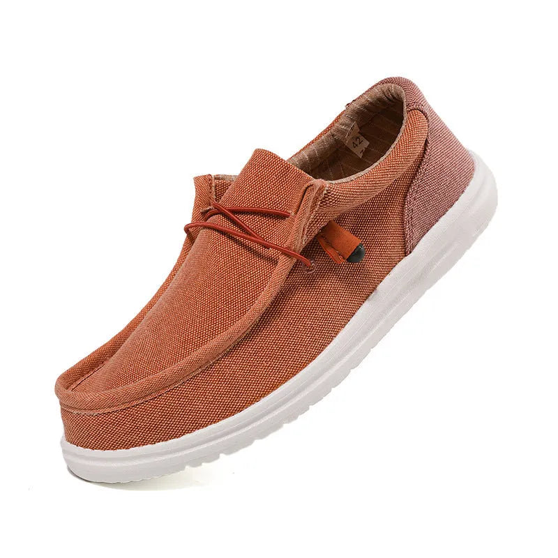 Men's orange and green canvas casual shoes with colourful splicing detail and rubber soles