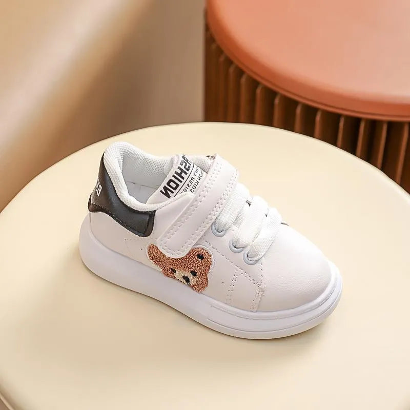 Baby Bear cartoon pattern kids sports sneakers in black, green, and khaki on a white background.